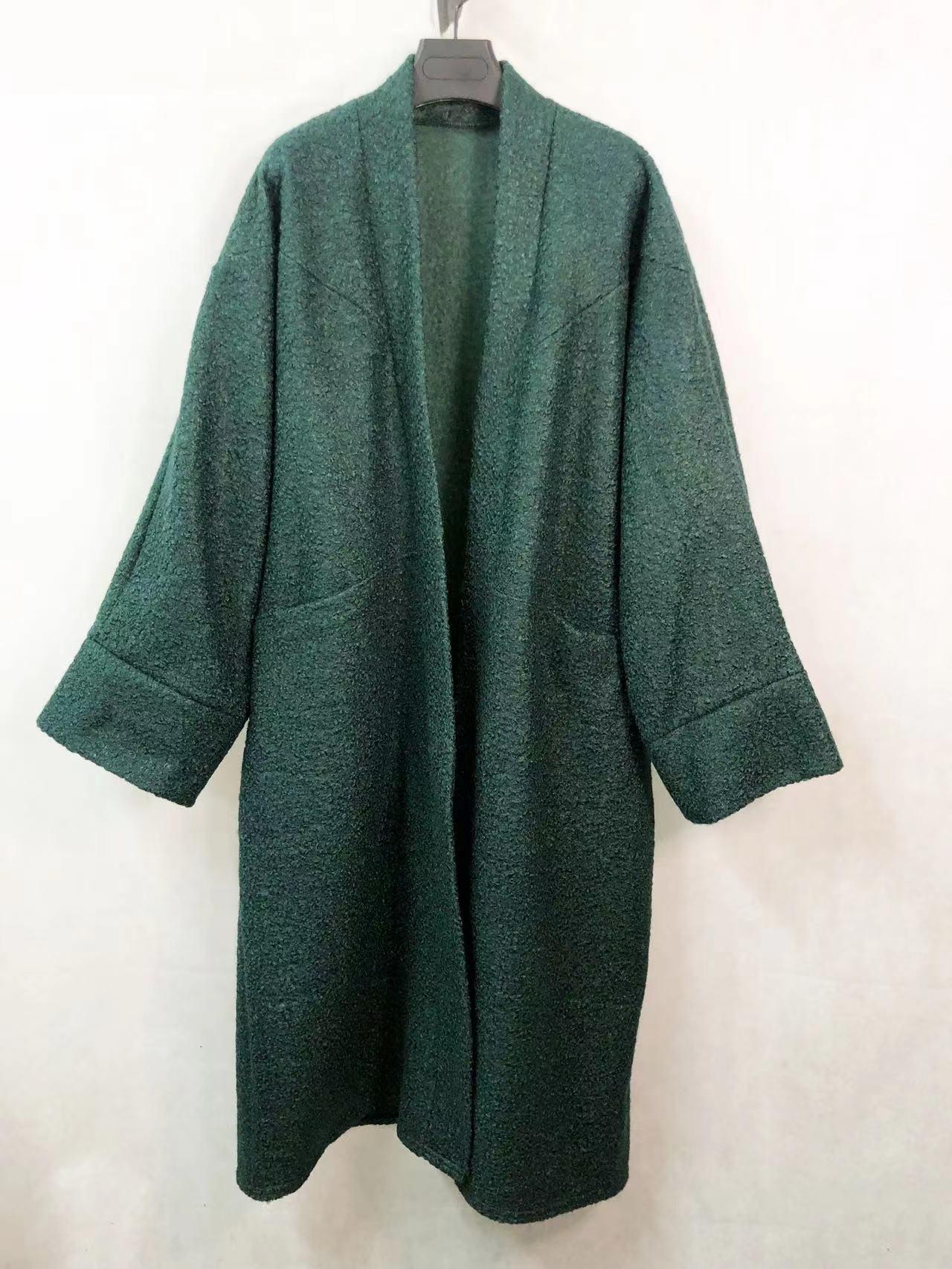 Le gilet long bouclé