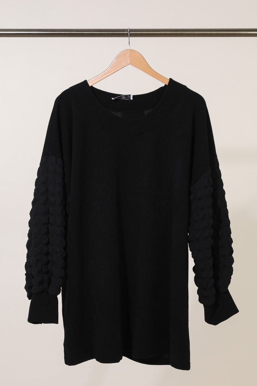 Le pull à manches texturées