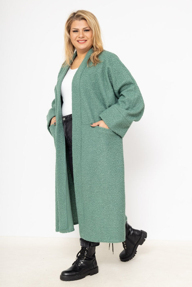 Le gilet long bouclé