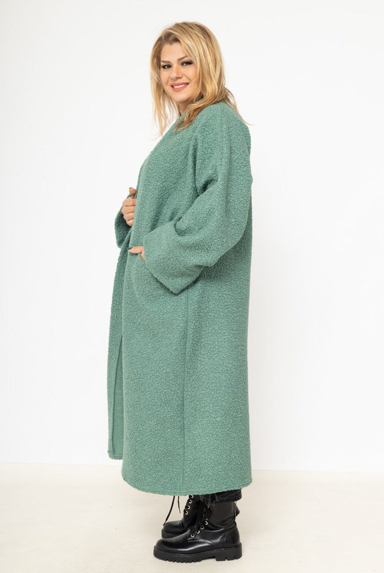 Le gilet long bouclé