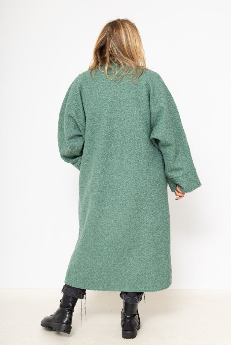 Le gilet long bouclé